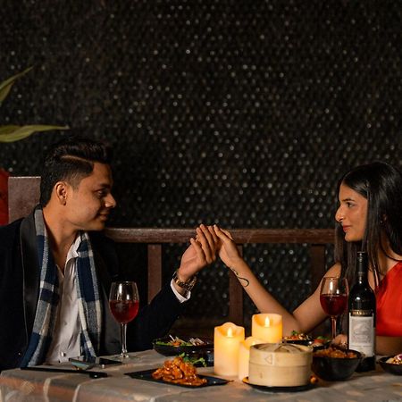 Hyatt Pune Exterior photo A couple dining together