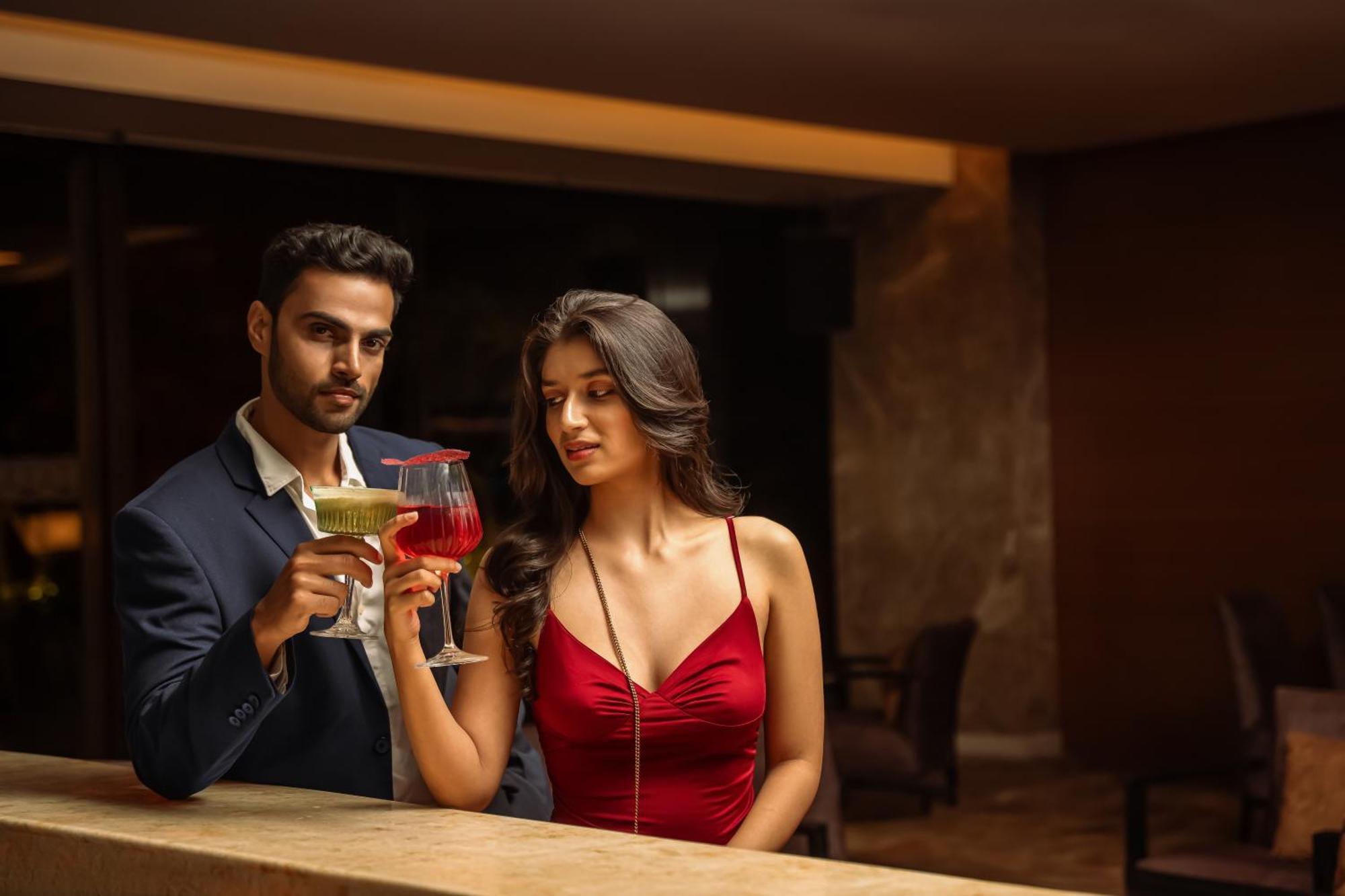 Hyatt Pune Exterior photo A couple drinking cocktails