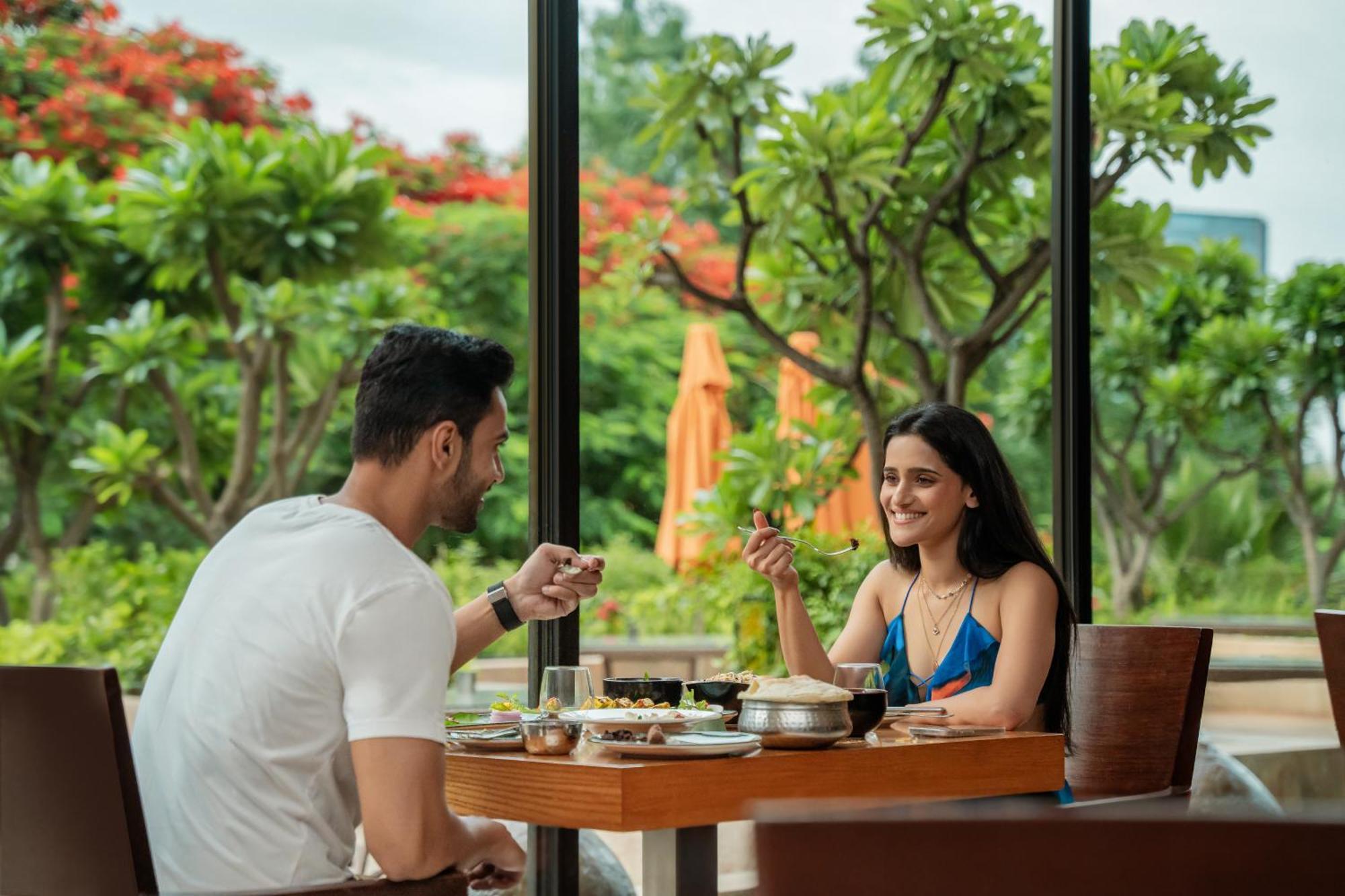 Hyatt Pune Exterior photo A couple dining at the hotel